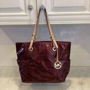 Michael Kors Embossed Merlot Signature Patent Leather EW Jet SetTote